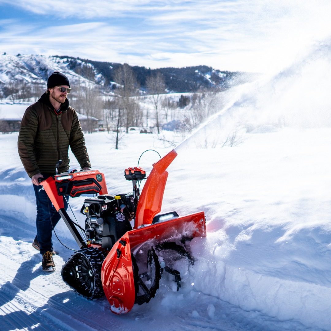 A Man Removing the snow from the backyard Game Arcade